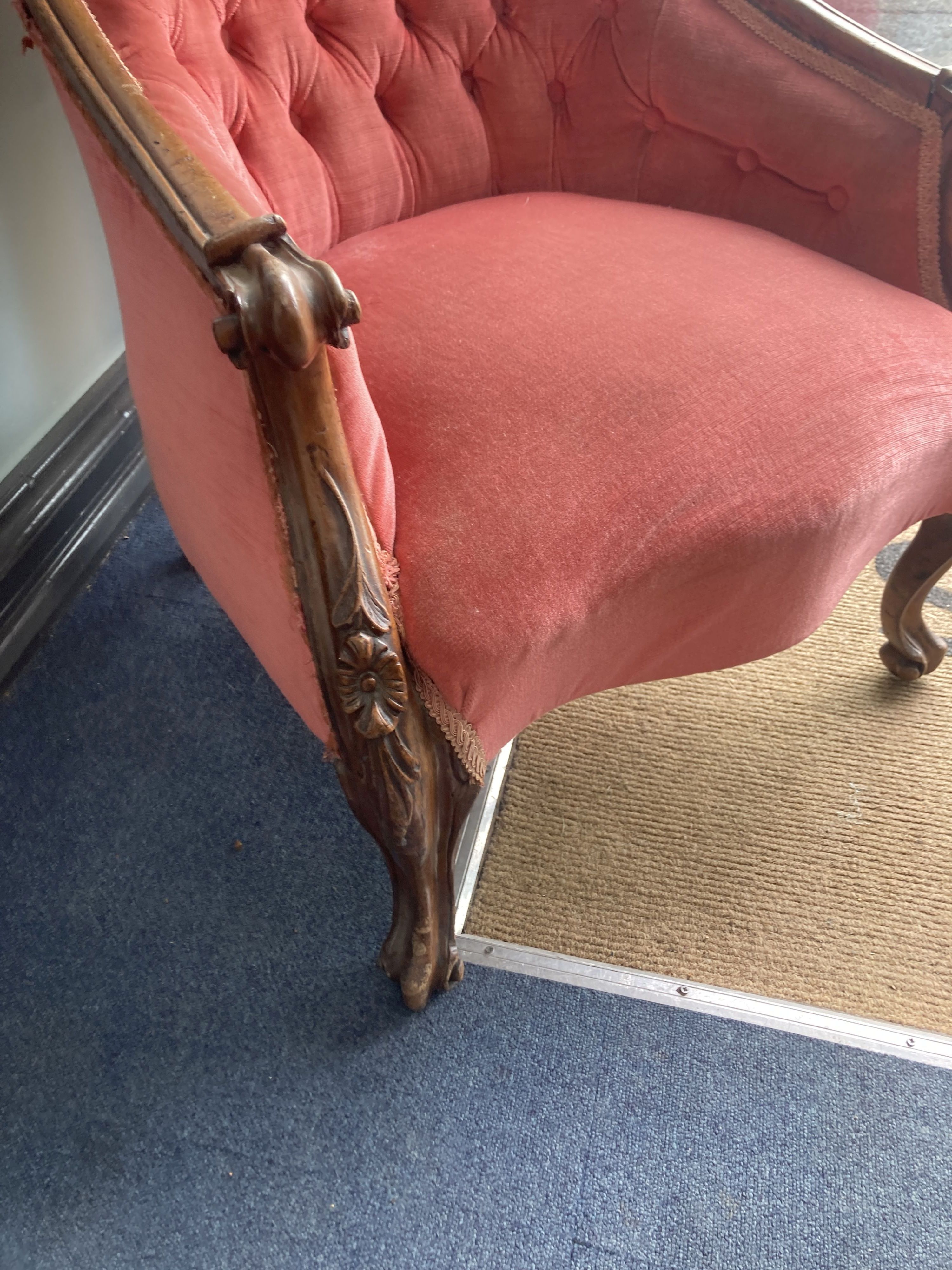 A Victorian walnut framed buttoned spoon back upholstered armchair, width 65cm, height 91cm